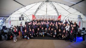 Dealer conference participants in a tent