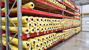 Rolls of material on warehouse racks